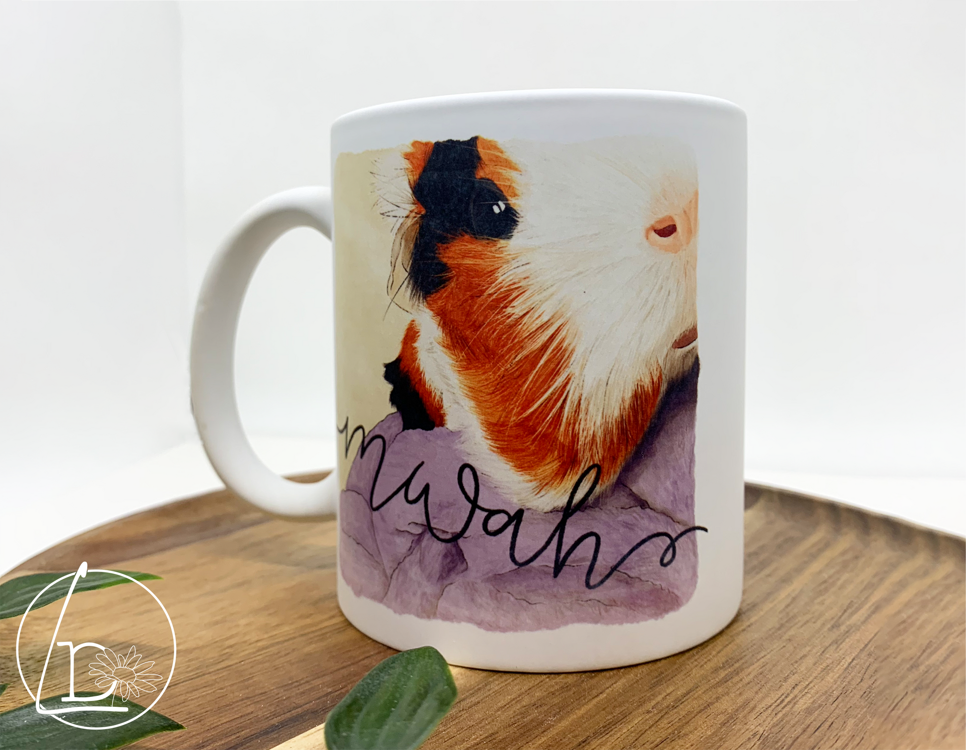 Illustrated mug of a black, white and ginger mug. The text says "mwah"